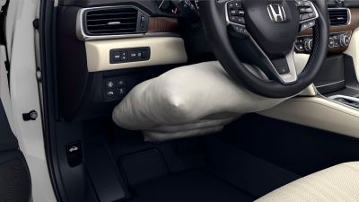 Closeup of inflated airbag under the steering wheel. 