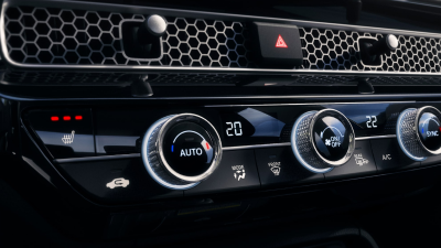 Closeup of the dials and buttons on the climate control.