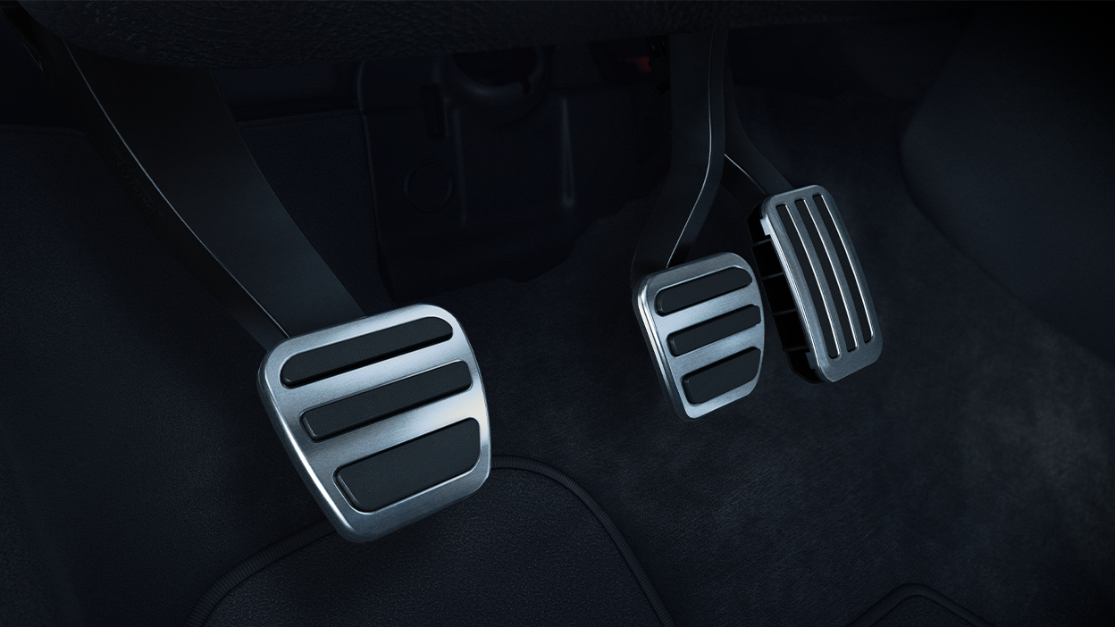 Closeup of aluminum-trimmed sport pedals.