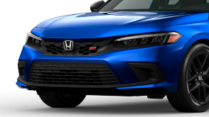 3/4 front closeup of blue Civic Si on white space.