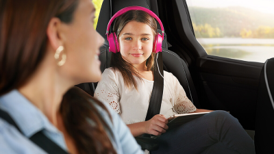 Interior view of Mom looking back at daughter in the back seat.