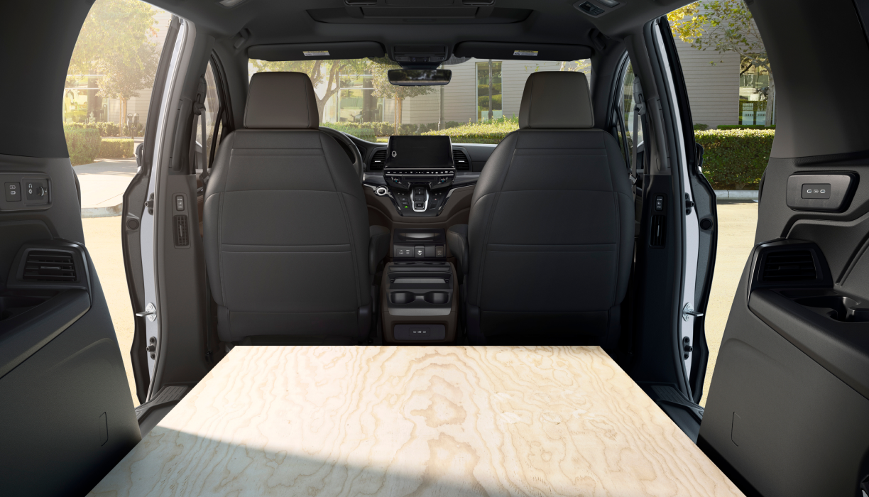 Interior view of Odyssey packed with sheets of plywood.