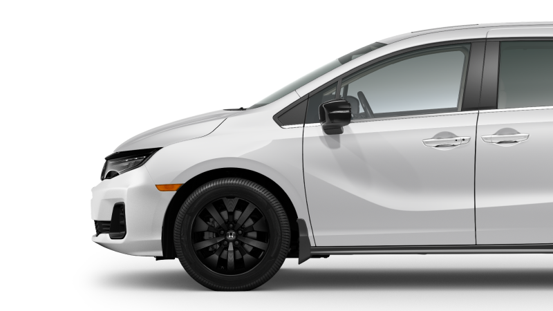 Side view of front of white Odyssey on white space, showcasing the front wheel.