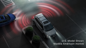 3/4 bird’s eye view of grey Passport parking. Pink and red sensor waves emit from the back.