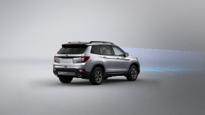 3/4 rear view of grey Passport. Blue sensor waves and lines emit from the front.