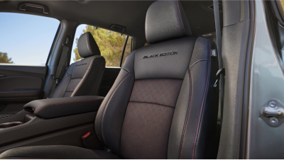 Closeup of front seats with red contrast stitching and “Black Edition” debossed into the backrest.